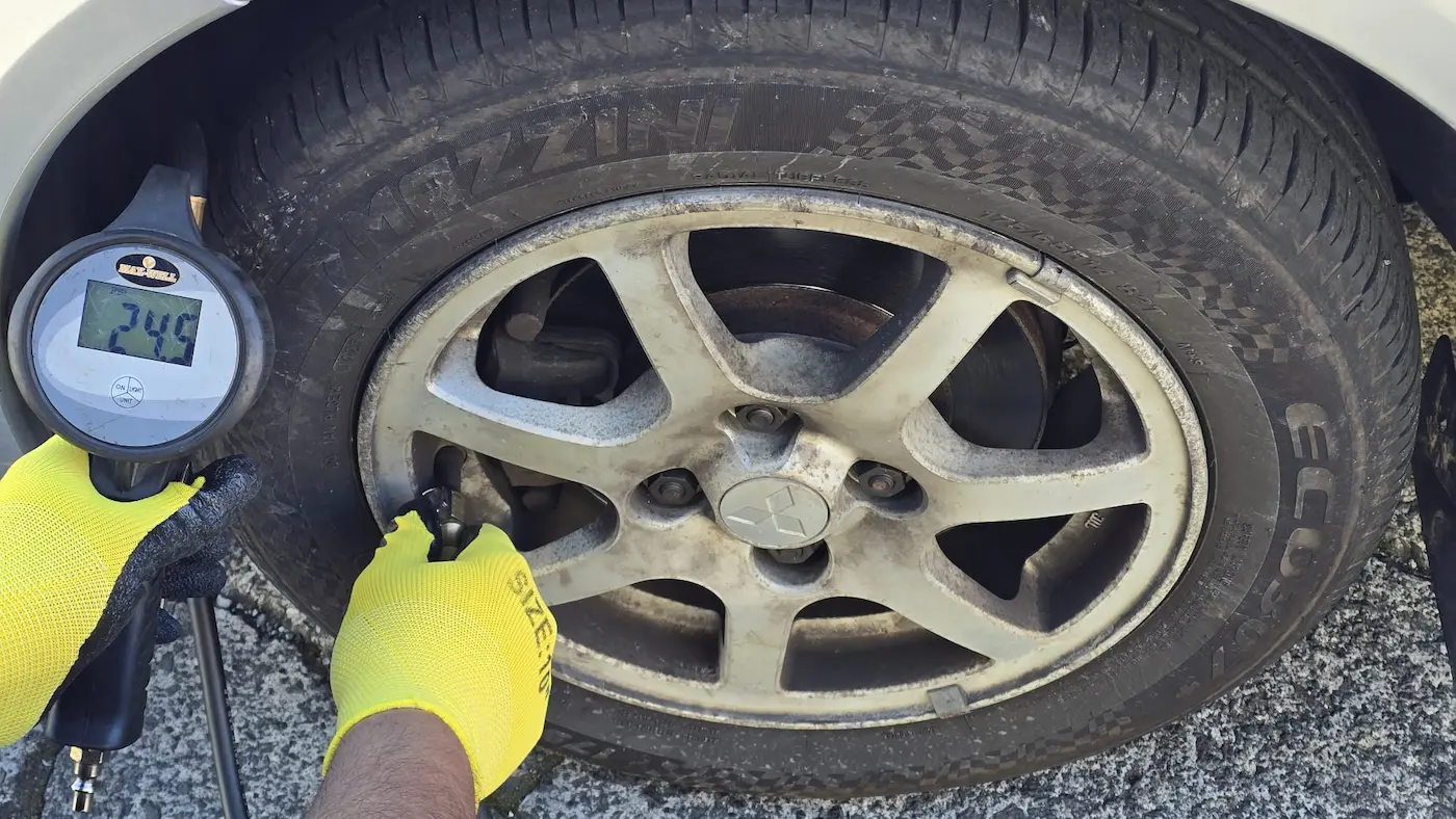 Checking tyre pressure at Auckland Tyres, Onehunga